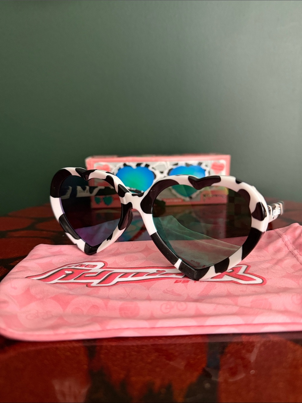 Pit Viper Heart-Shaped Sunglasses in Black and White Cow print
